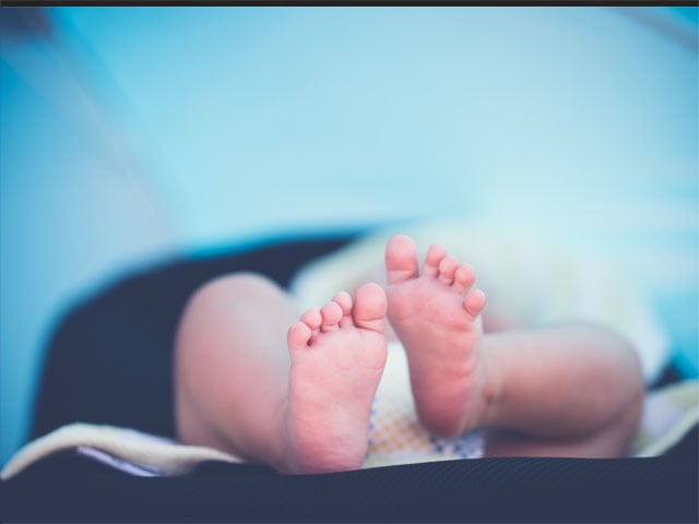 baby feet- blue background